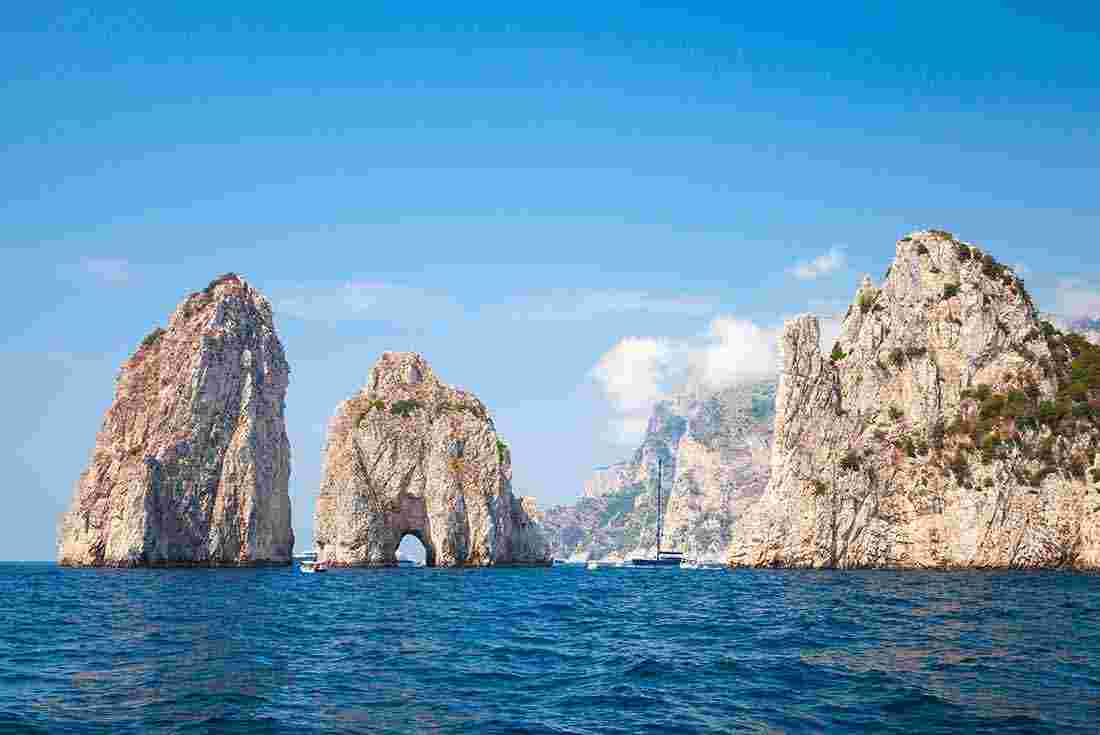 Visit the Faraglioni rocks in Capri