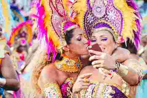 Two colourfully dresed women during Carnival in Rio.