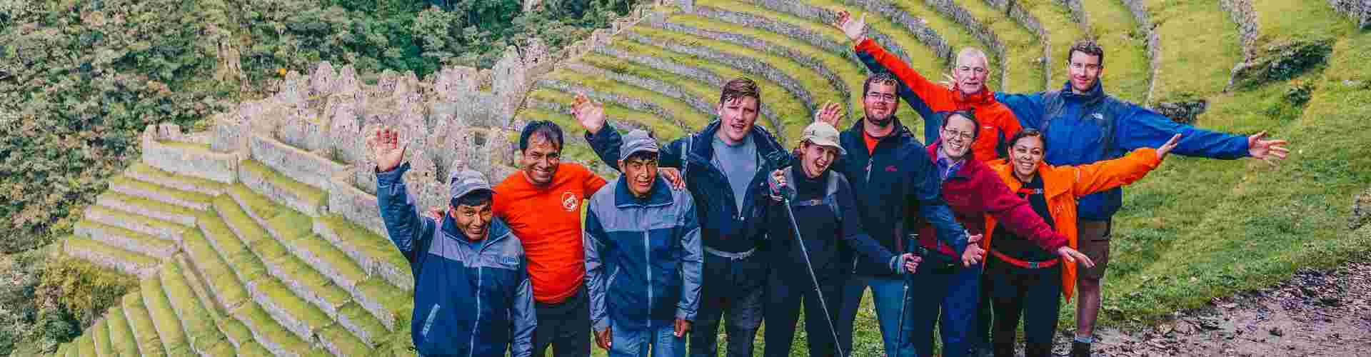 A group of hikers posing for a photo on the Inca Trail in Peru