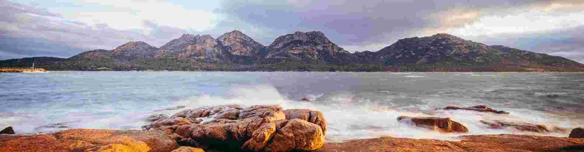 A scenic view of Freycinet National Park at sunset