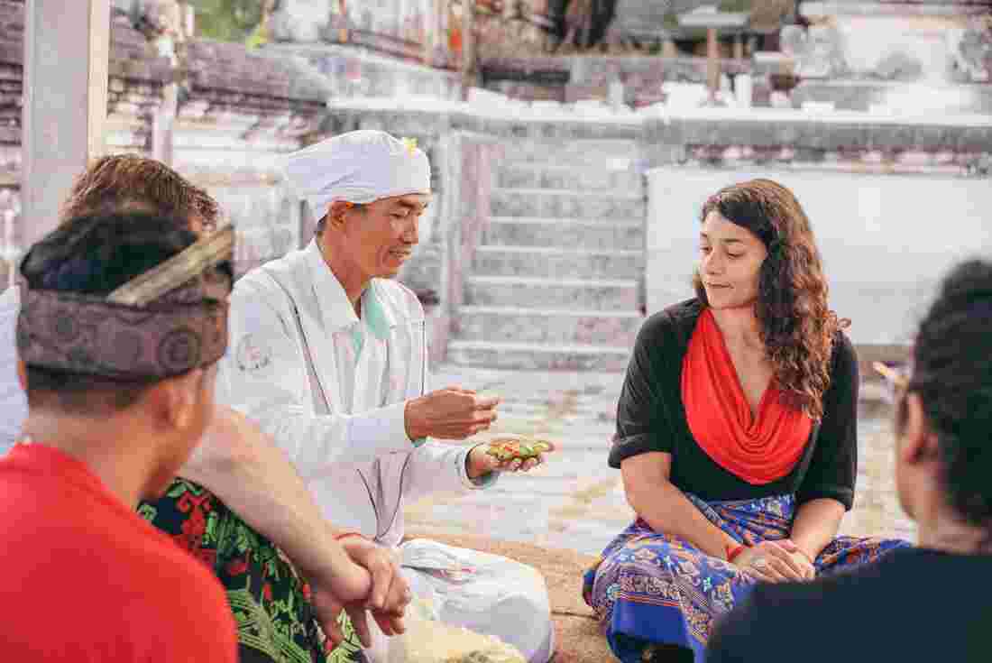 Intrepid travelers meet with a local holy man in Bali. 