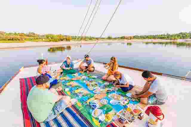 Intrepid travellers cruise down the nile on a felucca