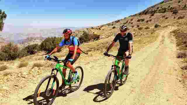 Two cyclists on the dirt track of Wadi Araba