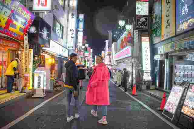 Two young travellers wandering through the streets of Tokyo 