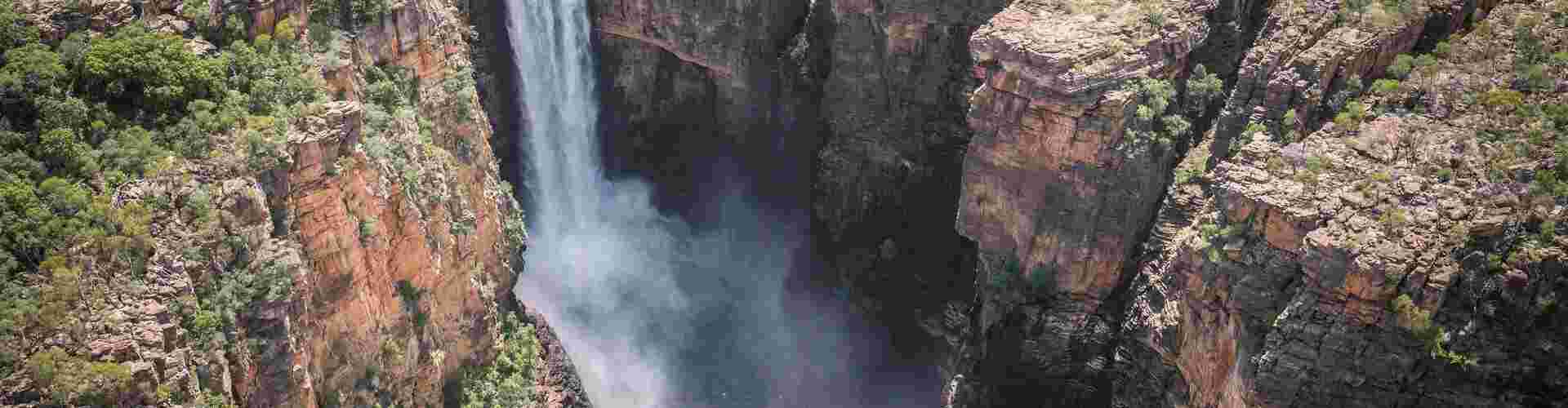 Water cascades down the cliffs of Jim Jim Falls in Kakadu National Park