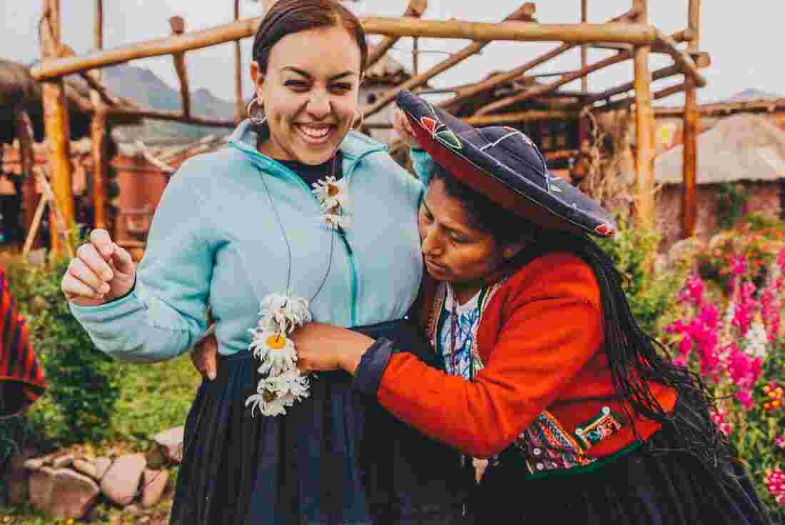 Traveller trying on traditional clothes in the Sacred Valley