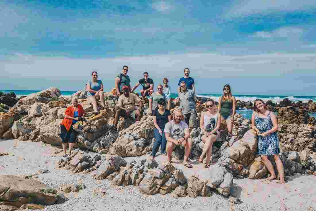 A group photo of travelers in Cape Agulhus, South Africa