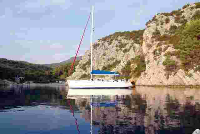 An Intrepid sailing vessel moored in a secluded bay in Croatia