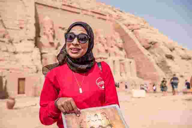 An Intrepid leader discussing the history of the ancient Pyramids of Giza in Egypt