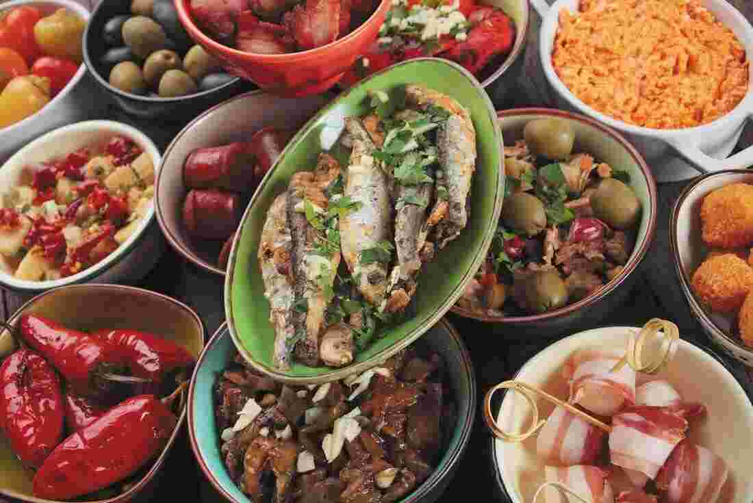 Tapas and Mediterranean food on table in Spain