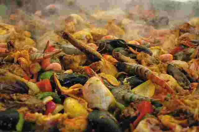 Paella simmering in a pan