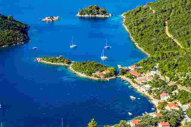Boats sailing off Mljet Islands in the turquoise Adriatic Sea in Croatia 