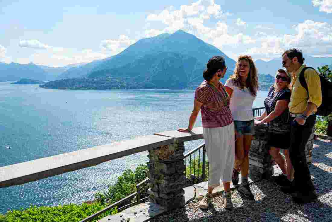 Cycle tour group take a break by Lake Como