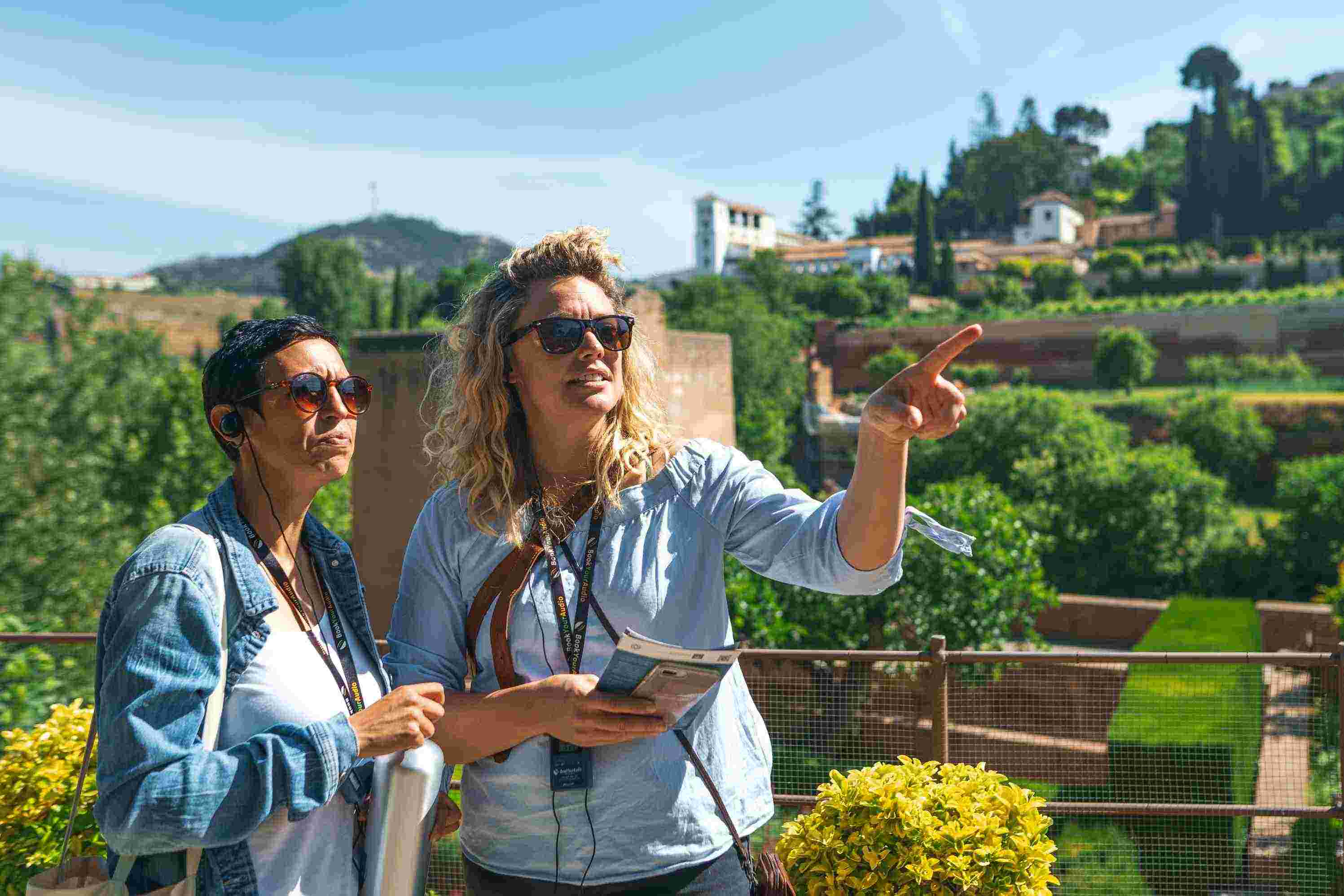 Two travelers exploring the gardens at the Alhambra in Spain