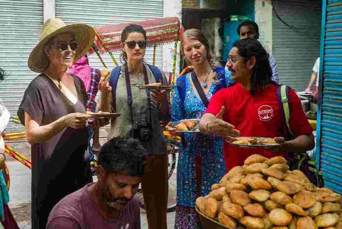 Travellers enjoying vegan street food in India