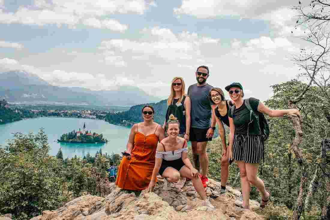 Group of travellers look out over Lake Bled 