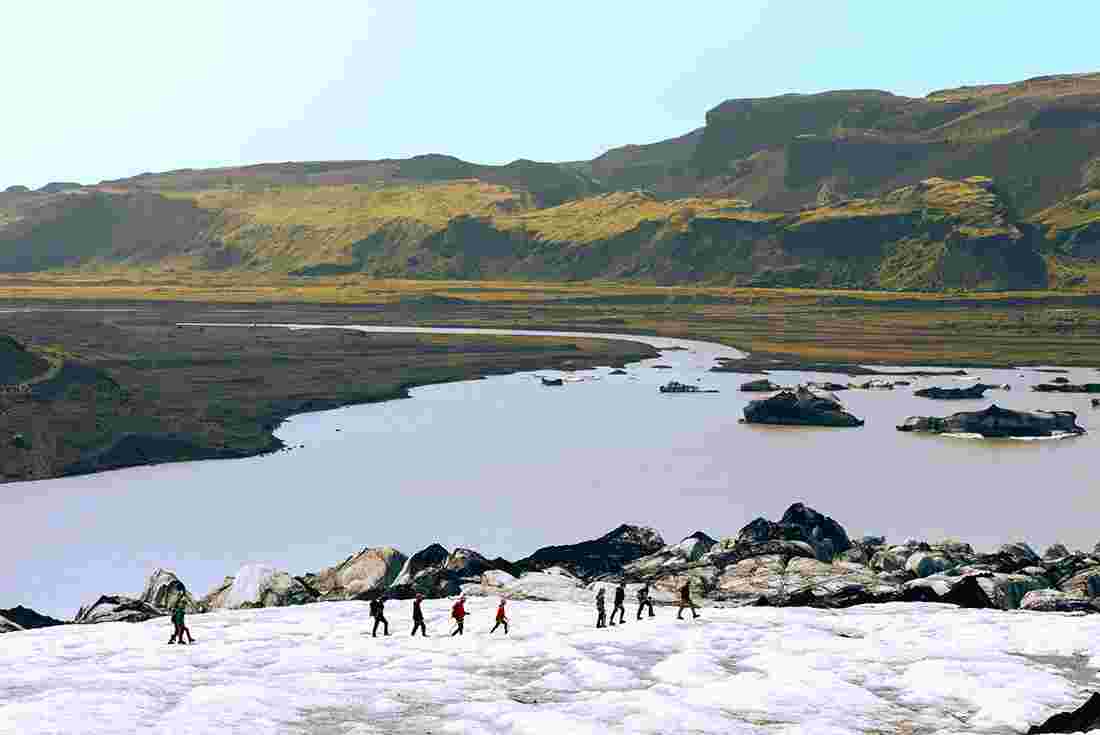 Group walkinga across Sólheimajökull Glacier