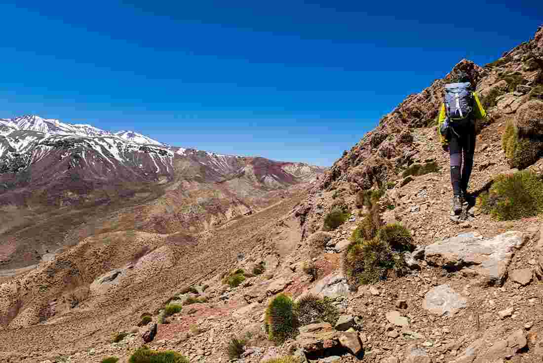 Traveller hiking on the M'goun Valley in Morocco