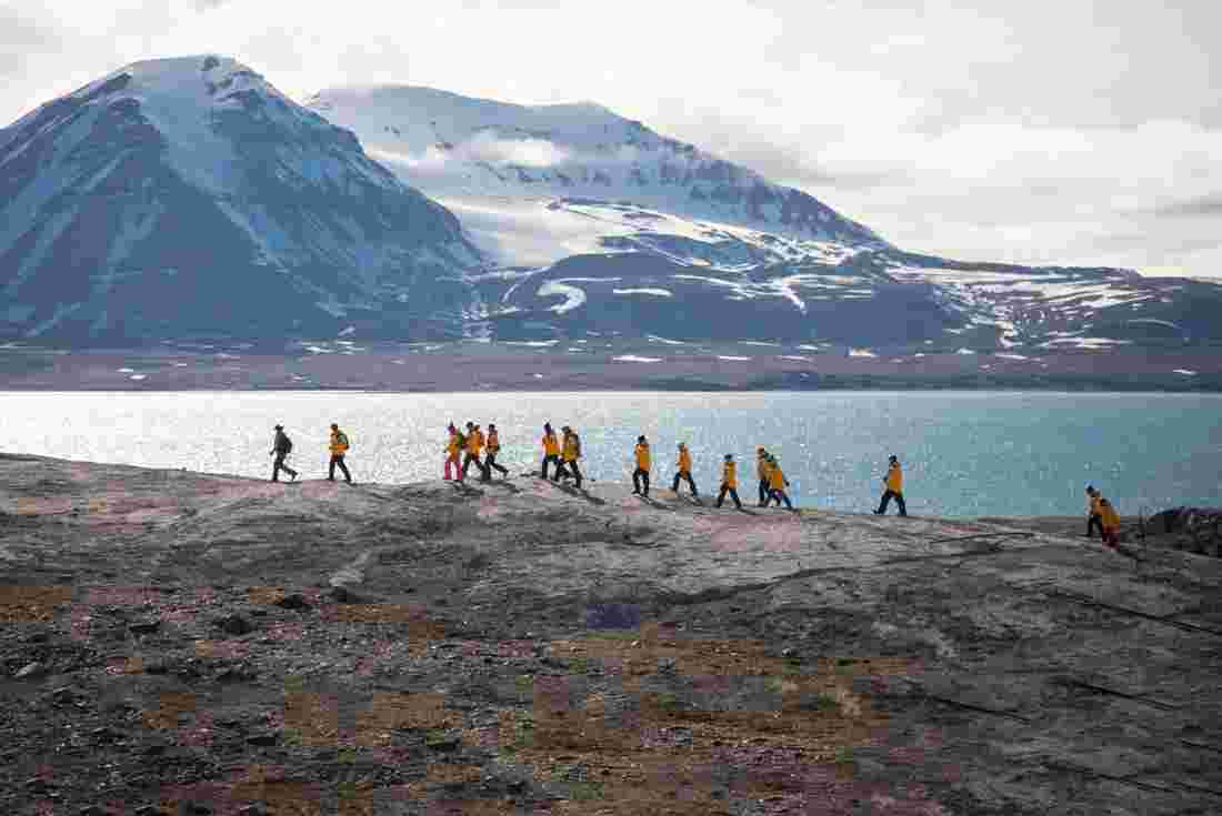 Group of Intrepid travellers hiking in Svalbard