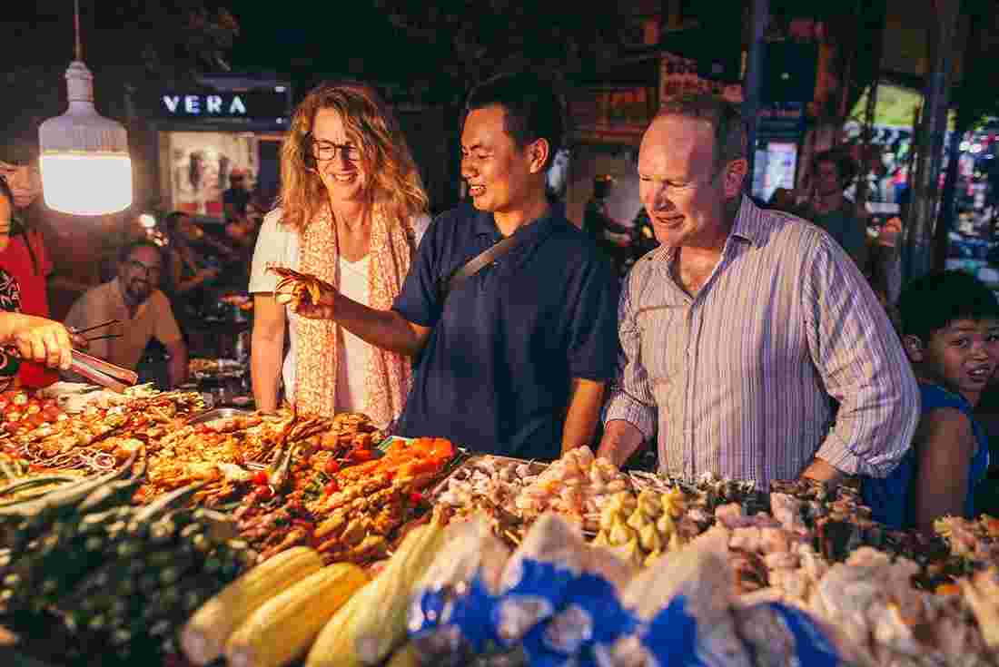 Vietnam insights with Peregrine Adventures: Sample local food at a street market
