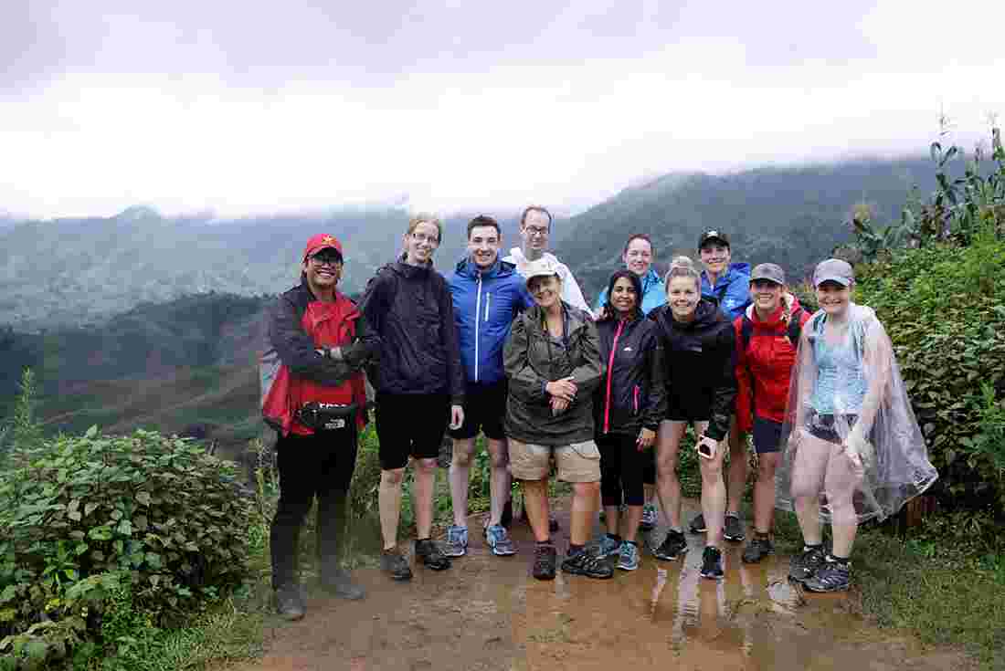 An Intrepid Travel group celebrating after completing a hike in Sapa, Vietnam.