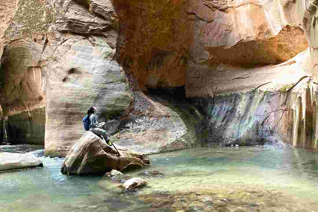 Hiker taking in the scenery, the Narrows, Zion NP, Utah, USA