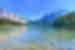 People canoeing across crystal clear waters in Emerald Lake, Yoho National Park