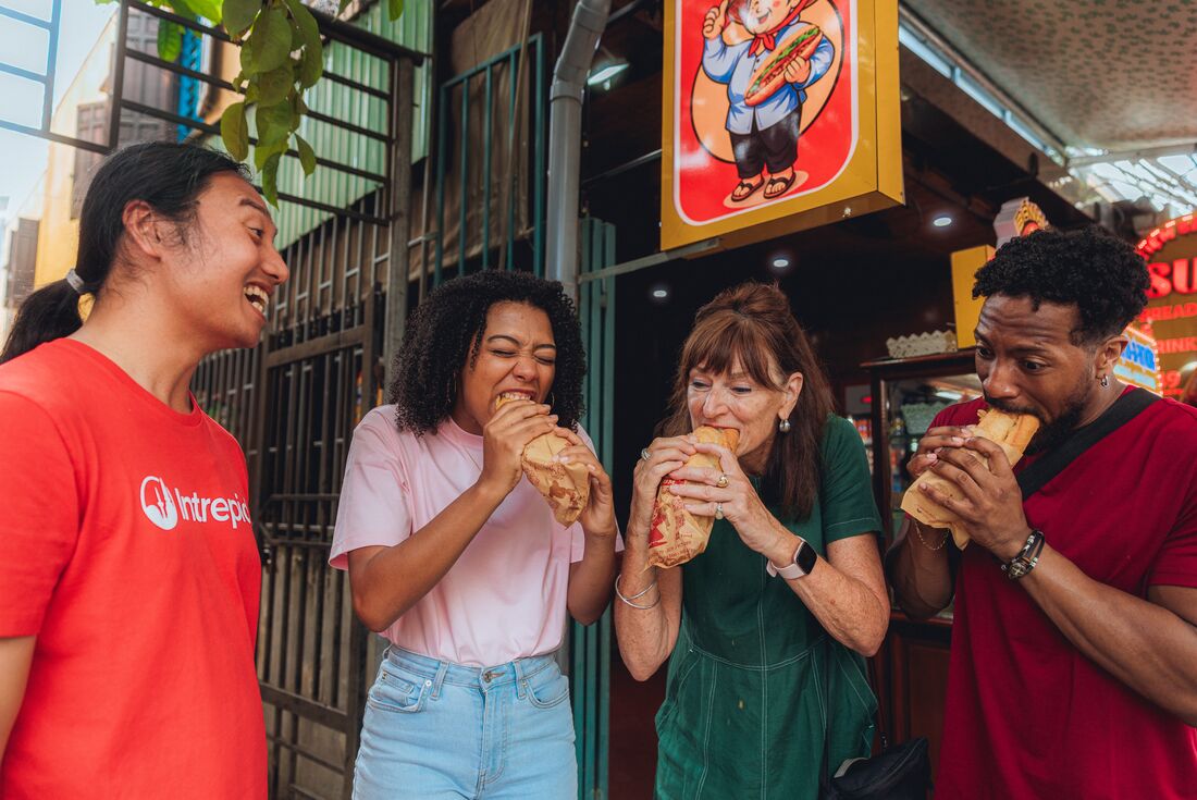 Leader takes traveller group to try banh mi in Hoi An, Vietnam