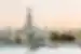 Wat Arun Temple in Bangkok with Cho Phraya river and Bangkok skyline at sunset