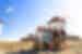 Travellers pose for a group shot with the iconic windmills of Mykonos in the Cyclades