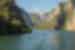 Boat gliding across the waters of Lake Komani, Albania