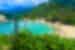 Tropical trees surrounding a beautiful beach in Palomino Beach, Columbia