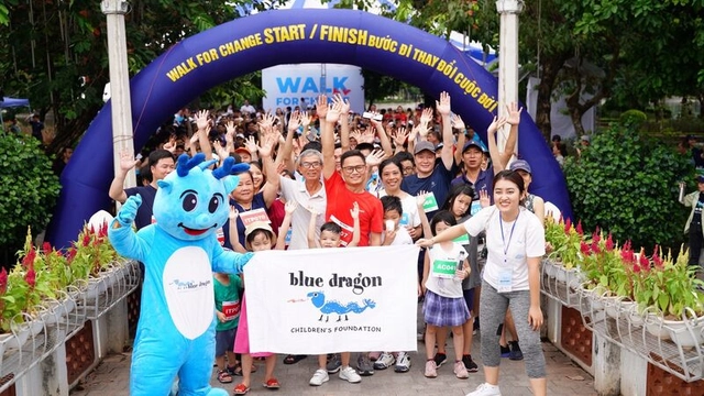 A crowd celebrating finishing the Blue Dragon walk