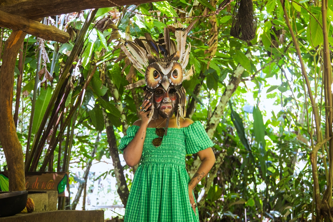 Intrepid traveller wearing mask during Terraba Indigenous mask carving lesson