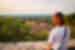 ZMPI - Woman overlooking San Gimignano at sunset, Tuscany, Italy