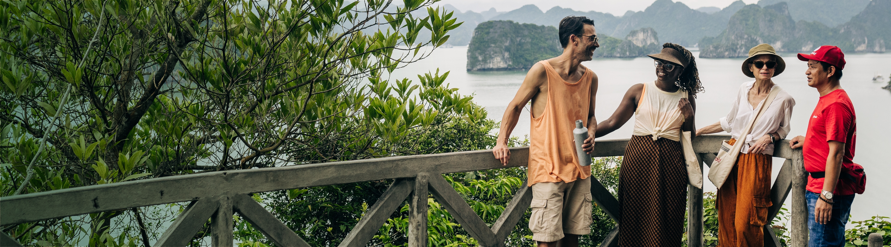 Four people in Halong Bay smiling