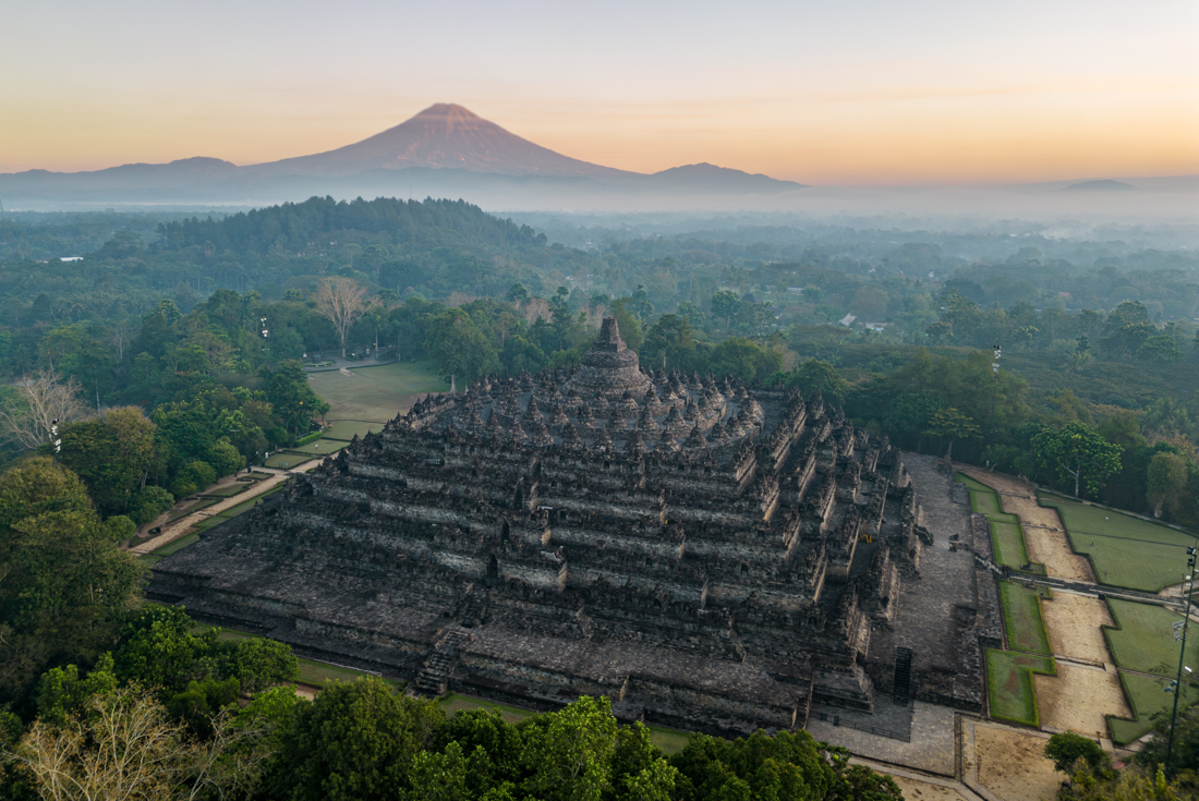 Borobudur, an ancient Buddhist Temple near Yogyakarta, in the shadow of Mount Merapi