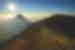 Intrepid travellers approaching Acatenango's peak near Antigua in Guatemala with Fuego beyond