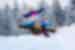 Father and two children pose with arms stretched out atop a tobaggon in snowy Finnish Lapland