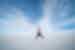 Man jumping at Salar de Uyuni salt flats, Bolivia