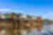 Kampong Phluk houses on high stilts stand in a river
