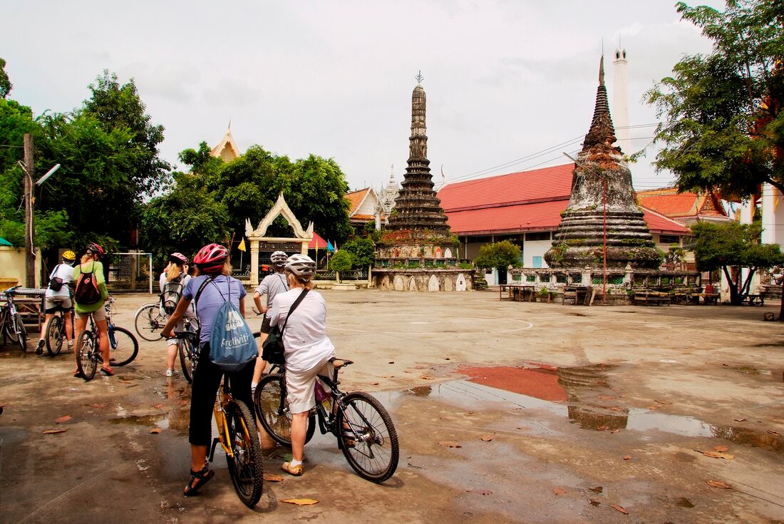 Cycling Travellers take a break at to enjoy a temple in Thailand