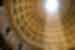 Tight shot of interior of the roof dome in Rome, Italy, with light and shadow highlighting the geometric shapes of architecture