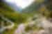 Intrepid travellers hiking in Theth National Park mountain valleys in Albania