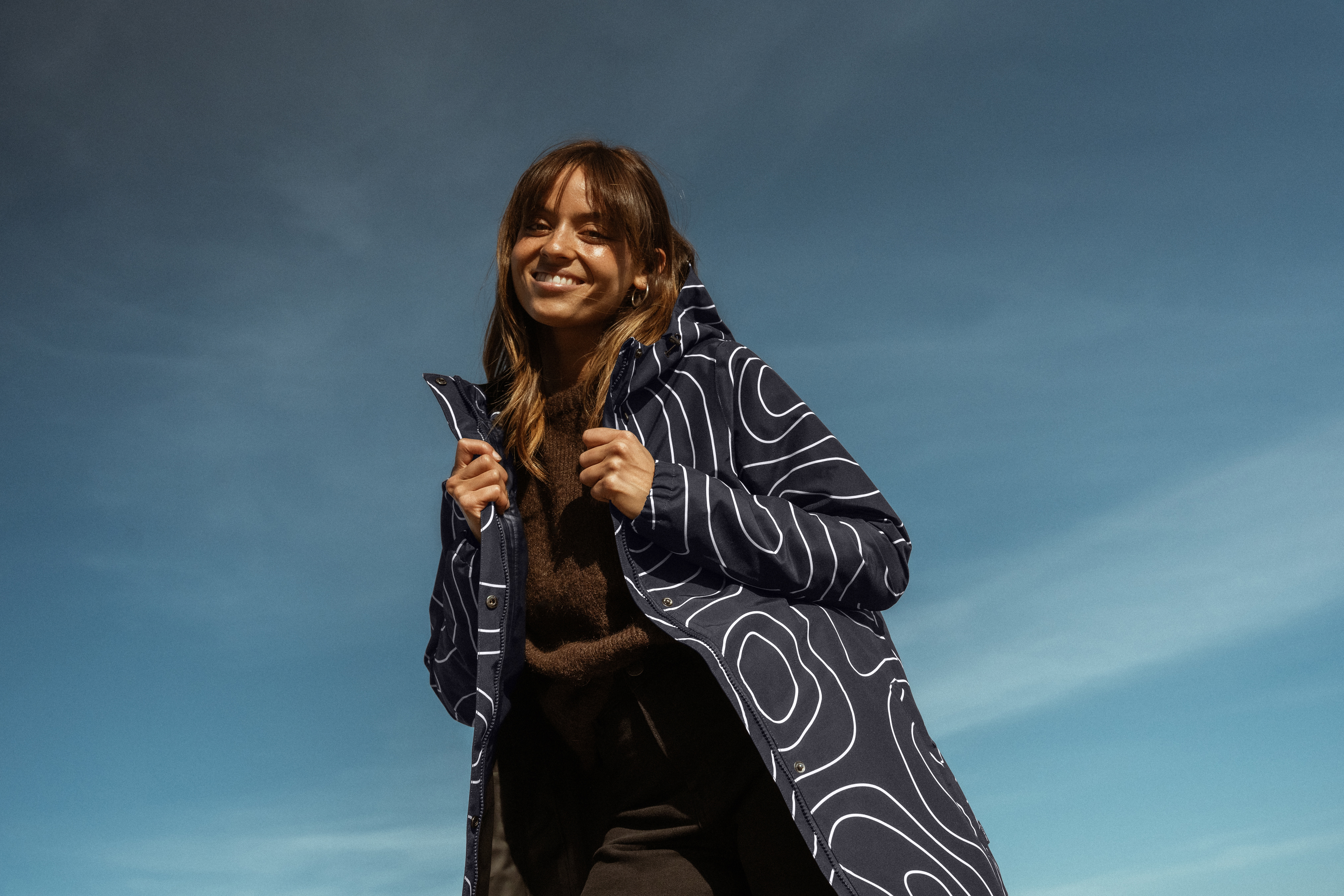 Woman in rain jacket on walking trip