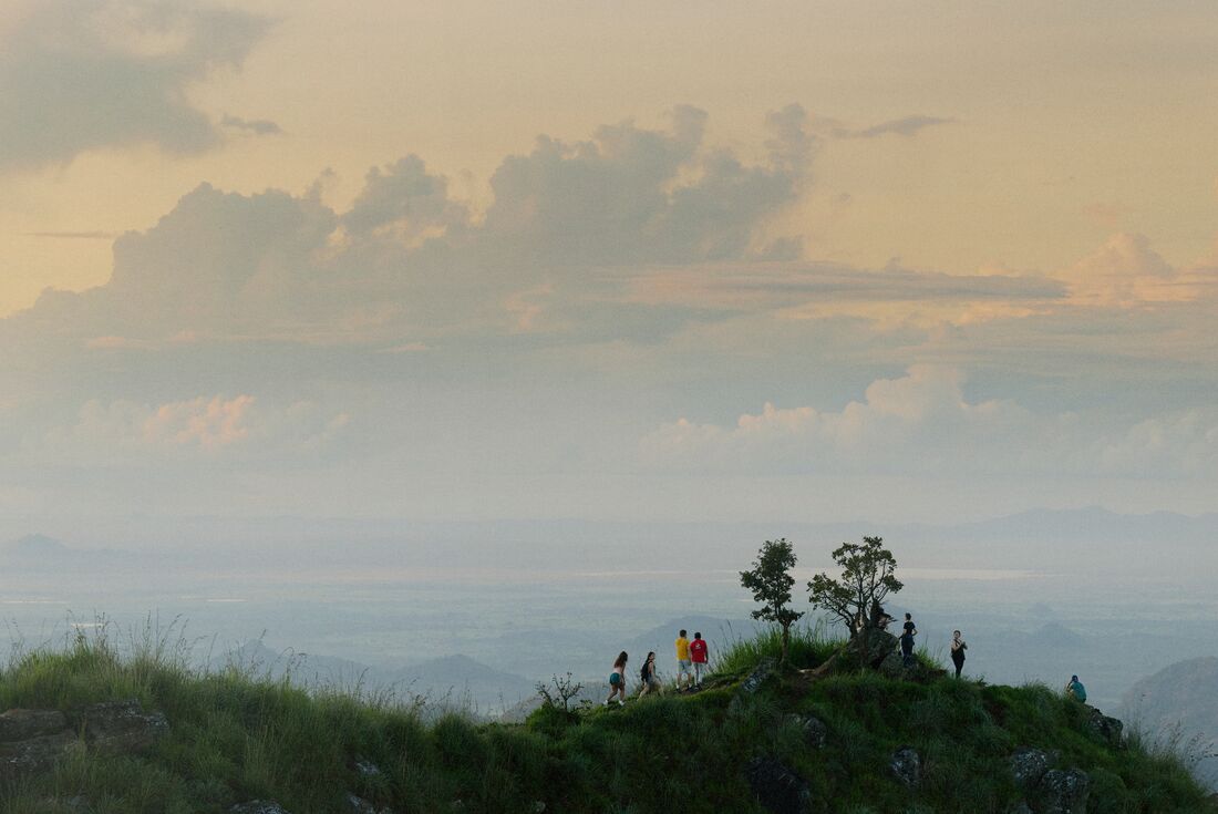 WIde view of Intrepid Travel group hiking on landscape of Pekoe Trail in Sri Lanka