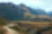 Intrepid leader on mountain bike rides ahead of group in Sacred Valley in Peru