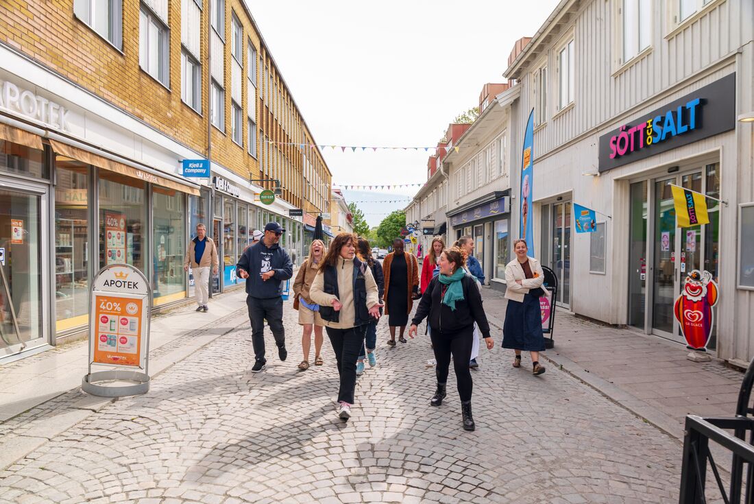 Group of travellers enjoying the town streets of Alingsas, Sweden