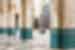 Local women walking through archways of Hassan II Mosque, Casablanca, Morocco