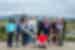 Group of Intrepid travellers pose for a group photo in front of the greenery in Thingvellir National Park